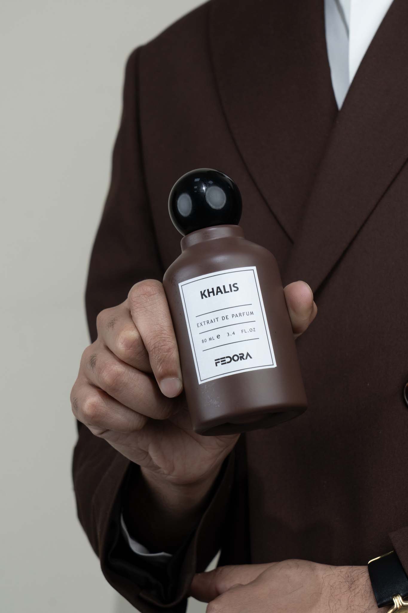 Khalis bottle held up