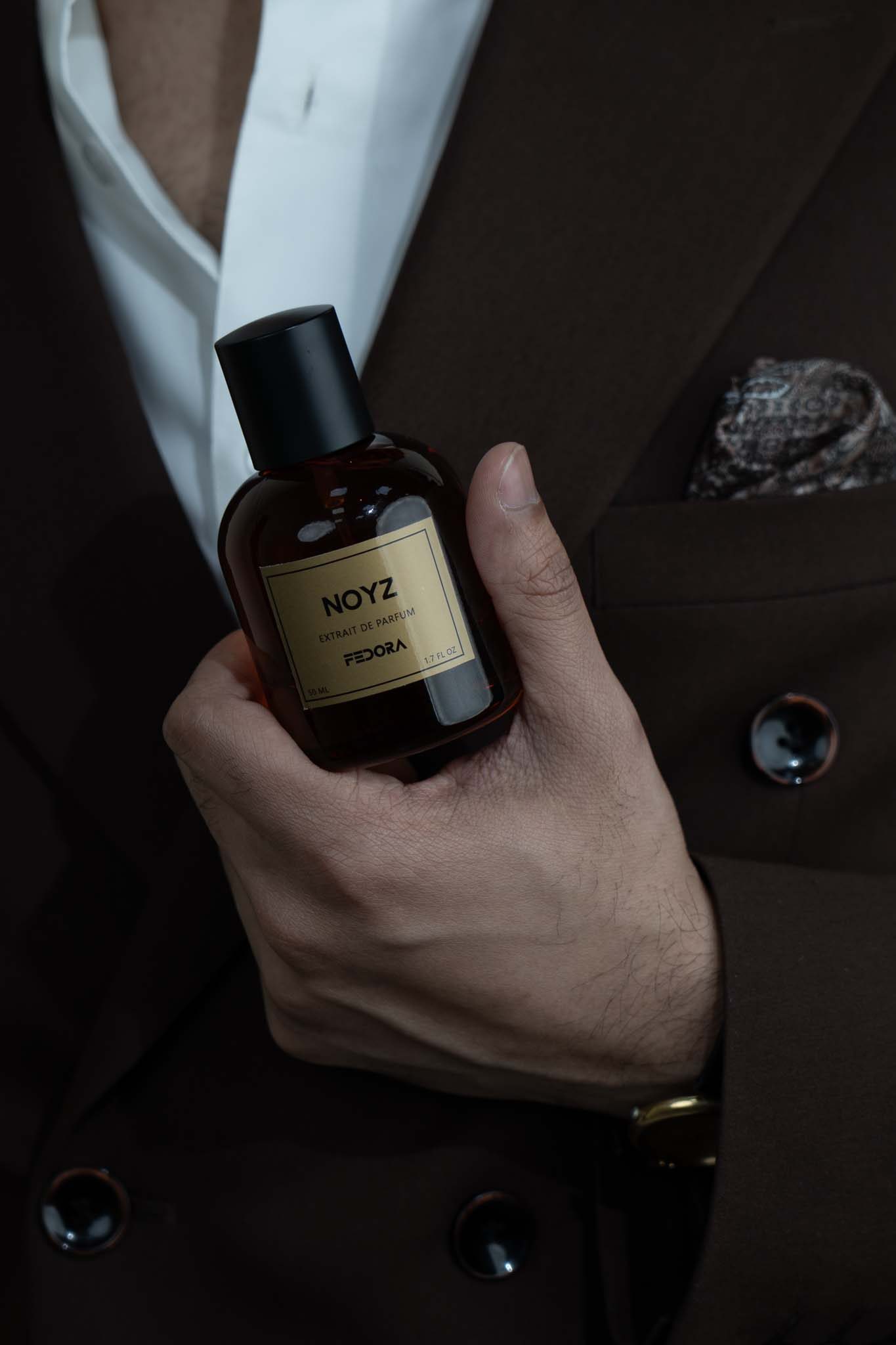 Noyz perfume held in hand